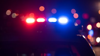 Photo of Kansas Patrol investigating body of man found on I-70