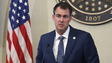 Photo of Stitt encourages people to visit – even as virus rages in Oklahoma