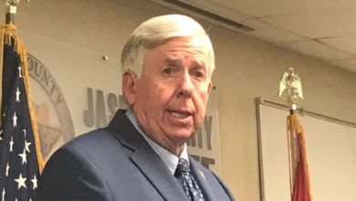 Photo of Flags flown at half-staff in Laclede County to honor former police officer.