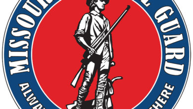 Photo of Kehoe signs executive order activating Missouri National Guard to help with storm response