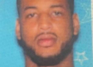 Photo of Bourbon County Sheriff searching for “Person of Interest” in felony pursuit