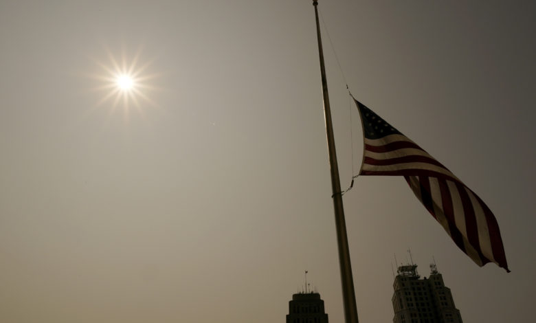 Missouri flag half staffed half staf