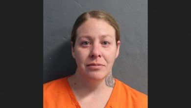 Photo of Afton woman charged with animal cruelty after tossing caged dog into Grand Lake