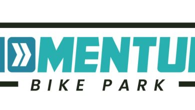 Photo of Ribbon cutting November 24th to open MOmentum Bike Park